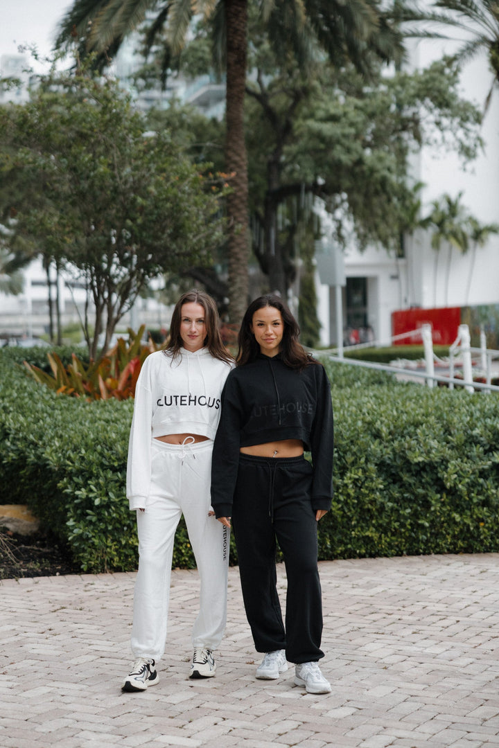 Model wearing the GluteHouse Crop Hoodie and Jogger Sweatpants Set in black